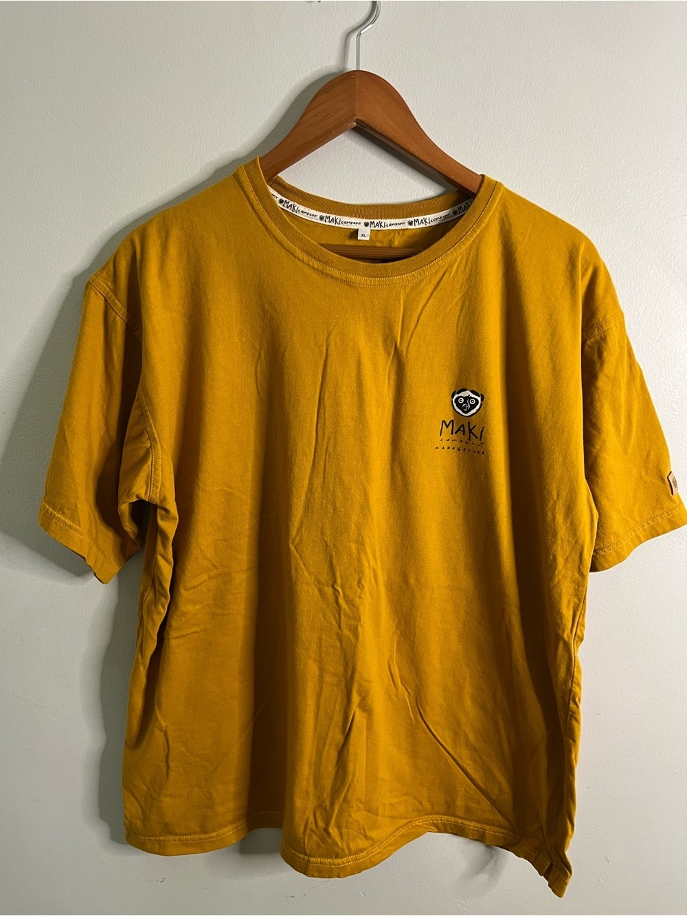 Maki Company Madagascar Lemurs Land men’s XL graphic tee in mustard yellow